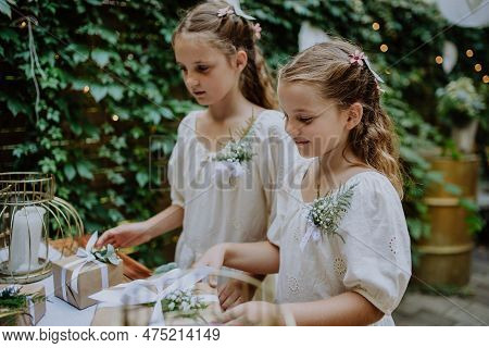 Little Girls At Outdoor Wedding Garden Party.