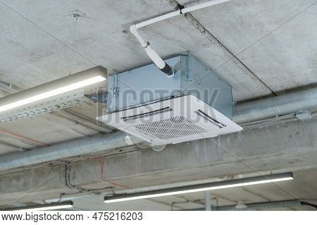 Industrial Air Conditioner In The Office On A Concrete Ceiling.
