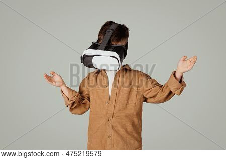 Inspired Surprised European 6 Years Old Little Kid In Vr Glasses Play In Online Game, Isolated On Gr