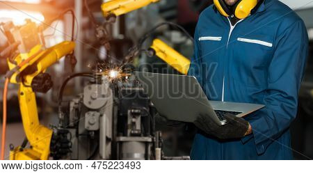 Engineer Use Advanced Robotic Software To Control Industry Robot Arm In Factory . Automation Manufac
