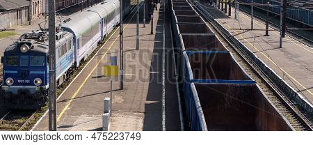 Bialogard, West Pomeranian - Poland - 2022: Express Train And Freight Train At The Railway Station