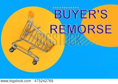Text Buyer's Remorse And Shopping Cart On Bright Yellow And Light Blue Background, Top View