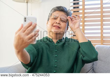 Presbyopia, Hyperopia Mature Asian Woman Holding Eyeglasses Having Problem With Vision Problem Tryin