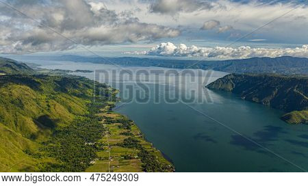 Aerial Drone Of Lake Toba And Samosir Island Among The Mountains In The Early Morning. Sumatra, Indo