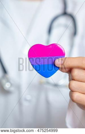 Bisexuality Celebrate Day And Lgbt Pride Month,  Lgbtq+ Or Lgbtqia+ Concept. Doctor Holding Purple, 