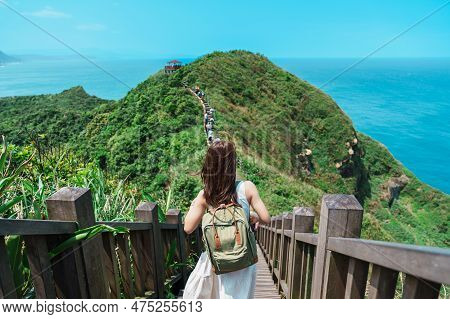 Woman Traveler Visiting In Taiwan, Tourist With Backpack Sightseeing In Bitou Cape Hiking Trail, New