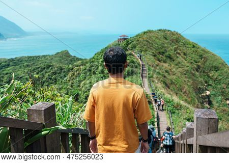 Man Traveler Visiting In Taiwan, Tourist Sightseeing In Bitou Cape Hiking Trail, New Taipei City. La
