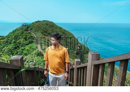 Man Traveler Visiting In Taiwan, Tourist Sightseeing In Bitou Cape Hiking Trail, New Taipei City. La