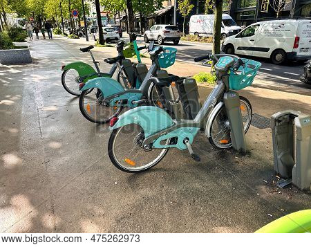 Paris, France - April 12 2023: Bicycles Parked At A Bike Sharing System Next To The Metro Station