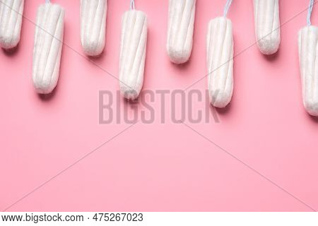 Medical Female Tampon On A Pink Background. Hygienic White Tampon For Women. Cotton Swab. Menstruati
