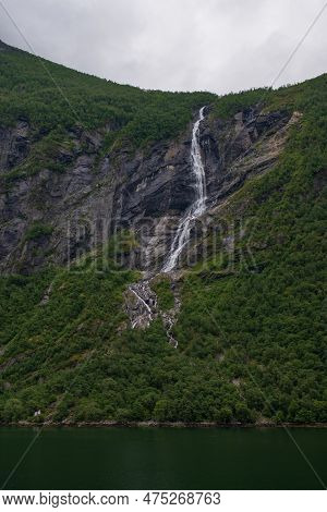 Little Waterfall. Views Inside The Geiranger Fjord Taken By The Ferry Hellesylt Geiranger. July 2019