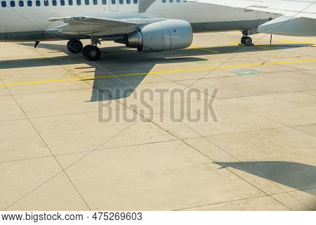 An Airplane At An Airport Runway, Ready To Transport Passengers Across The World From Europe To Afri