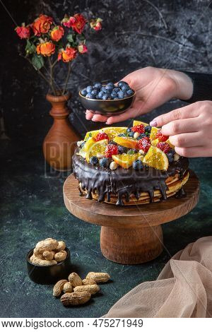 Front View Yummy Chocolate Cake Getting Decorated With Fresh Fruits By Female On Dark Background Dou