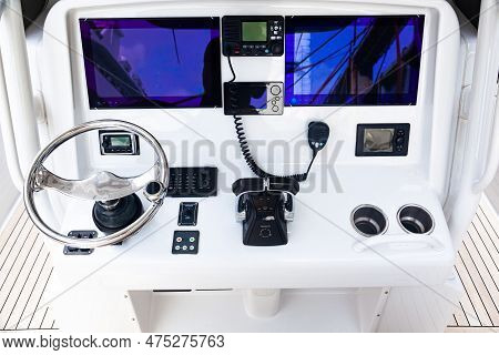 Luxury Yacht Control Panel With Steering Wheel, Gear Levers, Navigation Devices, Control Buttons And