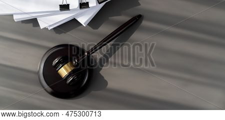 Closeup Top View Black Wooden Gavel Hammer And Legal Document On Wooden Office Desk Background As Ju