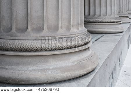 Architectural Detail Of Greek Style Columns At A Courthouse, Bank Or Capital Building