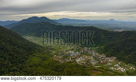 Top View Of Town Among Mountains And Farmland In A Mountain Valley. Sumatra, Indonesia.