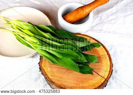 Wild Garlic. Wild Garlic On A Wooden Board On A White Tablecloth.