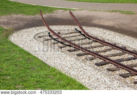 Westerbork, Netherlands - June 08, 2021: Railroad Track Bent Upwards As A Symbol Of Destruction In W