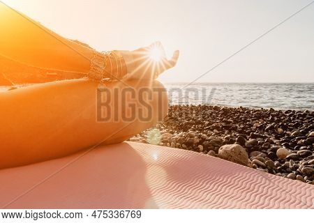 Woman Sea Yoga. Happy Woman In White Swimsuit And Boho Style Braclets Practicing Outdoors On Yoga Ma