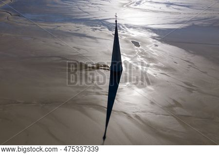 Abstract Aerial Silhouette View Of Church Tower With Cross And Shadow, Flooded By Copper Mining Resi