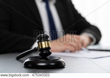 Focus Gavel Hammer For Righteous And Equality Judgment With Blur Background Of Lawyer Colleagues Or 