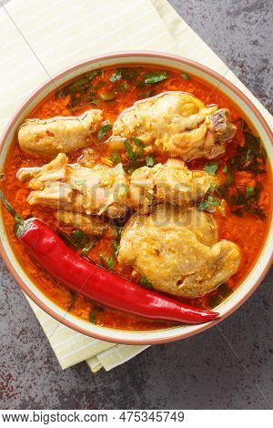 Chicken Cooked In Spicy Gravy Made With Authentic Flavour Of Malvani Closeup On The Bowl On The Tabl