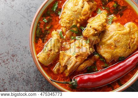Malvani Masala Spicy Chicken Curry With Coconut Closeup On The Bowl On The Table. Horizontal Top Vie