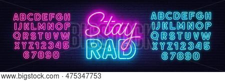 Stay Rad Neon Quote On Brick Wall Background.