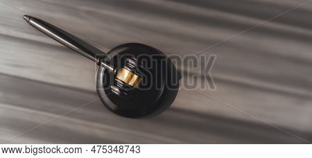 Closeup Top View Black Wooden Gavel Hammer On Wooden Office Desk Background As Justice And Legal Sys