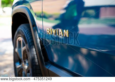 Futuristic-looking Rivian Branding Text On Driving Door Of Brand-new Electric Vehicle R1T Pickup Tru