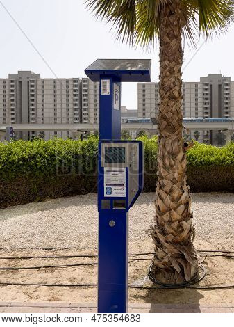 Dubai, United Arab Emirates - 7th October, 2021 : A Modern Smart Solar Powered Parking Meter With La