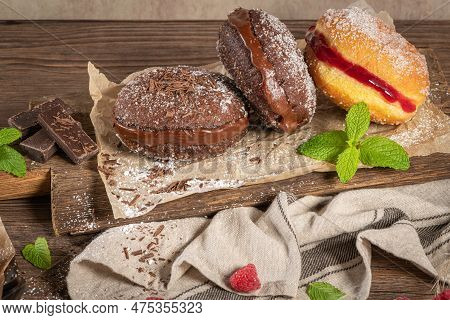 Bolas De Berlim, Or Berlin Balls. Portuguese Fried Dough With Sugar, Filled With Chocolate Or Raspbe