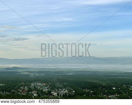 View Of The Village Of Arshan In The Haze. Valley Of The Sayan Mountains. Buryatia. Russia.