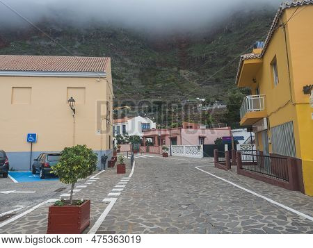 Agulo, La Gomera, Canary Islands, Spain, December 27, 2021: Cobbled Street With Colorful Houses In T