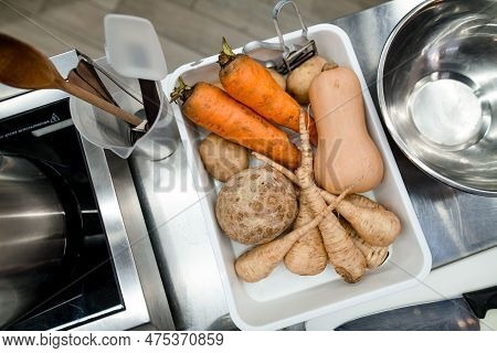 Tray With Raw Vegetables For Cooking At Restaraunt. Pumpkin, Potato, Carrot, Celer And Parsnip.
