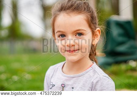 Little Girl Face Portrait - Toddler Smiling At Camera - Close Up Blu Eyes Kid