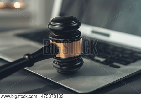 Symbolizing Justice And Legal Authority, Golden Balanced Scale And Gavel On Desk With Laptop In Law 