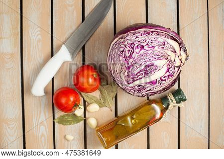 Top View Fresh Purple Cabbage With Tomatoes Garlic And Olive Oil On The Rusic Wooden Desk Meal Veget