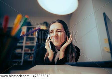 Woman Speaking On The Phone In A Loud Home Office