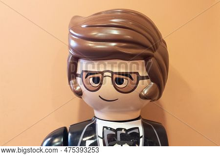 Lyon , Aura France - 04 24 2023 : Playmobil Toys Head Of Man In Suit With Bow Tie Wearing Glasses Fr