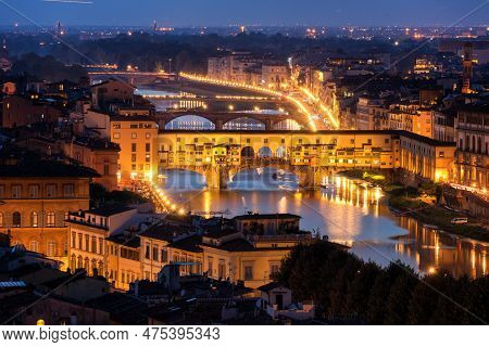 Florence Ponte Vecchio Bridge At Night Skyline In Italy. Florence Is Capital City Of The Tuscany Reg