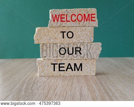 Welcome To Our Team Symbol. Concept Words Welcome To Our Team On Brick Blocks On A Beautiful Wooden 