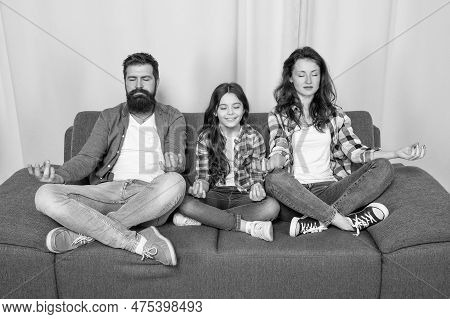Happy Family Maditating Sitting On Sofa At Home, Yoga