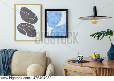 Warm And Cozy Interior Of Living Room Space With Mock Up Poster Frame, Wooden Table, Beige Sofa, Rat
