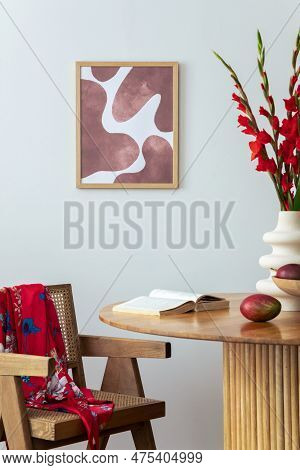 Warm And Cozy Interior Of Living Room Space With Mock Up Poster Frame, Wooden Table, Red Flowers, Ki