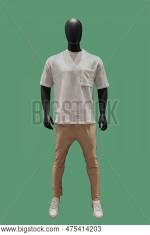 Full Length Image Of A Male Display Mannequin Wearing Collarless White Shirt And Light Brown Trouser