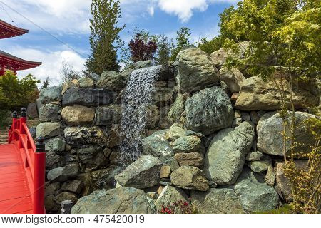 Large Otaki Waterfall In The Japanese Garden Of Krasnodar City Park In Spring.