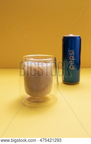 Drinking Glass With Pilk, Trendy Soda Milk Drink, Beverage. Pepsi On Yellow Background. Refreshment.