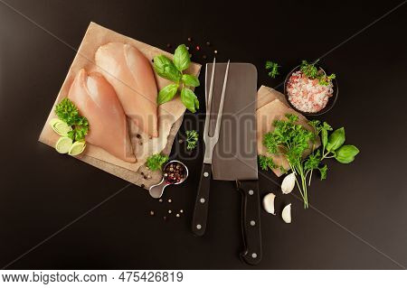 Raw Chicken Meat.raw Fresh Chicken Fillet With Fresh Herbs On A Black Background.copy Space.food For